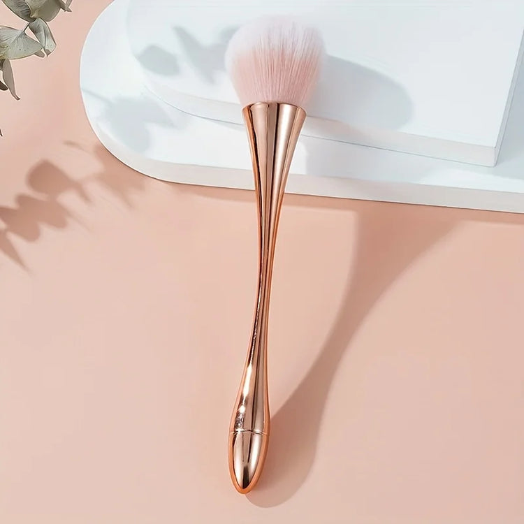 Soft-bristle cosmetic brush beside compact powder