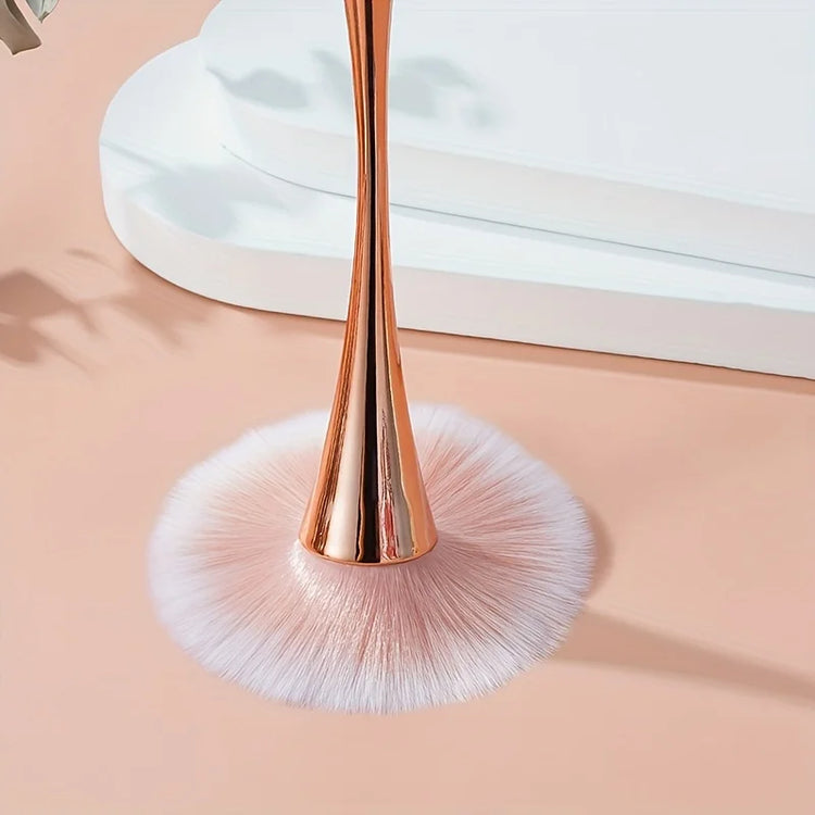 Cosmetic brush with rose gold fan design on white background