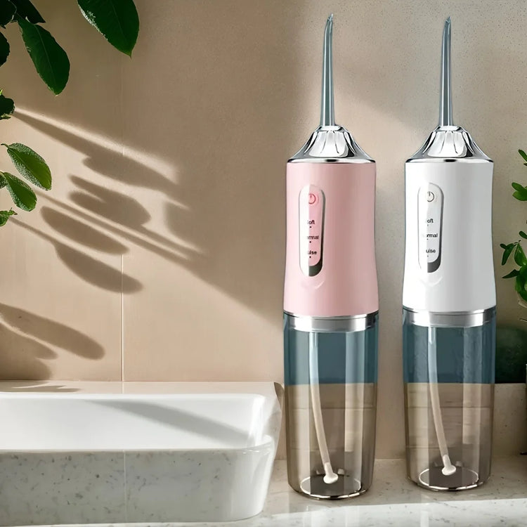 Water flosser for teeth cleaning showing 4 nozzles and USB port