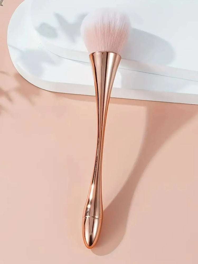 Cosmetic brush with rose gold fan design on white background