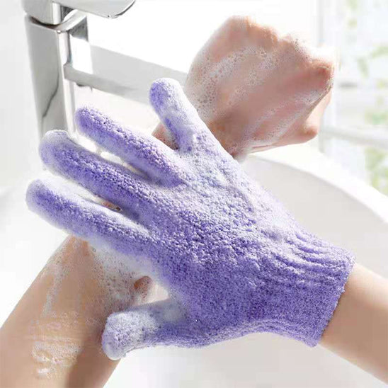 Exfoliating bath products including shower gloves and back scrub towel for deep cleansing and smooth skin.