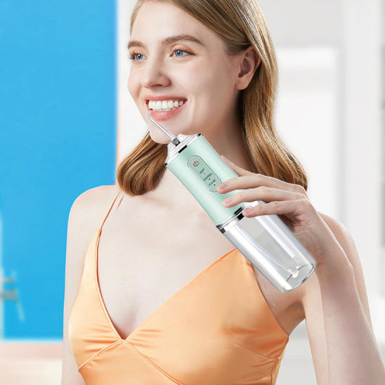Portable Oral Irrigator Water Flosser with detachable tank and nozzles