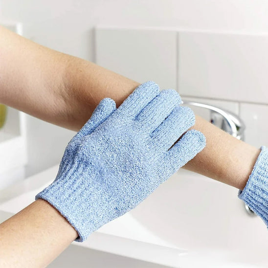 Exfoliating bath products including shower gloves and back scrub towel for deep cleansing and smooth skin.