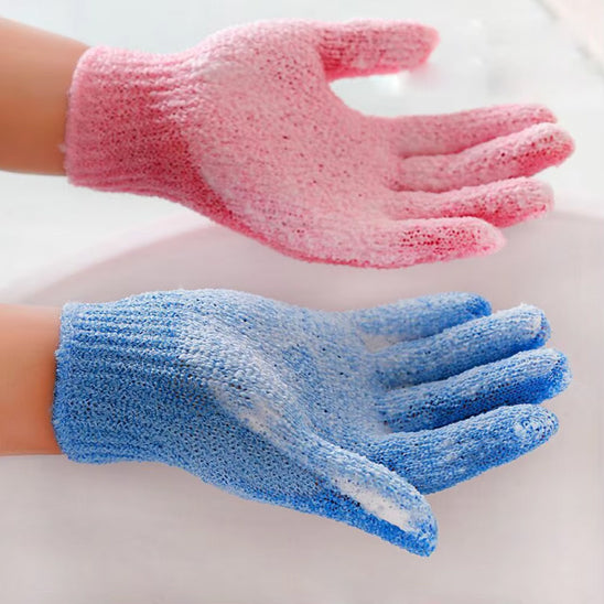 Exfoliating bath products including shower gloves and back scrub towel for deep cleansing and smooth skin.
