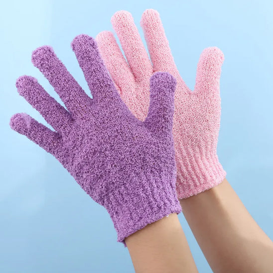 Exfoliating bath products including shower gloves and back scrub towel for deep cleansing and smooth skin.
