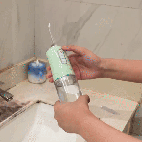 Portable Oral Irrigator Water Flosser with detachable tank and nozzles