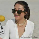 Real baroque pearl choker necklace on display