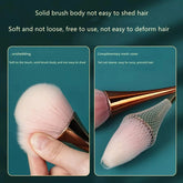 Cosmetic brush with rose gold fan design on white background