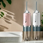 Water flosser for teeth cleaning showing 4 nozzles and USB port