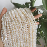 Natural freshwater pearls close-up shot”


