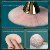Makeup brush applying highlighter to cheekbone